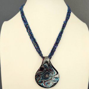 Glass pendant necklace on multi iridescent seed bead strands